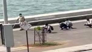 Maske takmayanlara 'ördek yürüyüşü' cezası