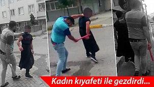 Eşini telefonla taciz eden adamı kadın kıyafeti ile gezdirip dövdü
